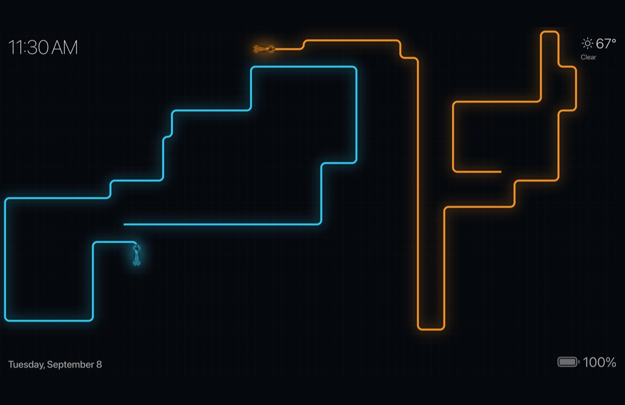 The Lightcycles screensaver — two light trails curving across a dark grid, with the time, weather, date and battery in the corners