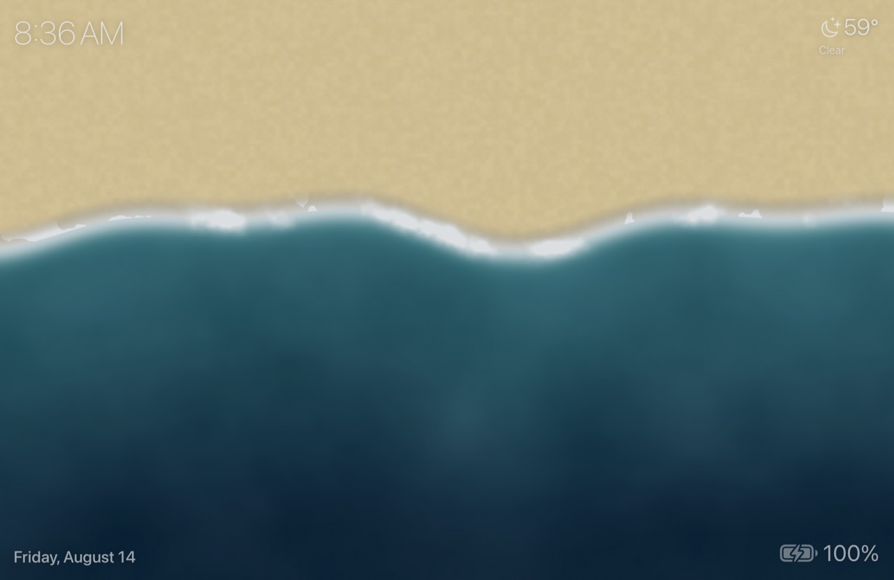 The Shorebreak screensaver — waves washing over sand, seen from above